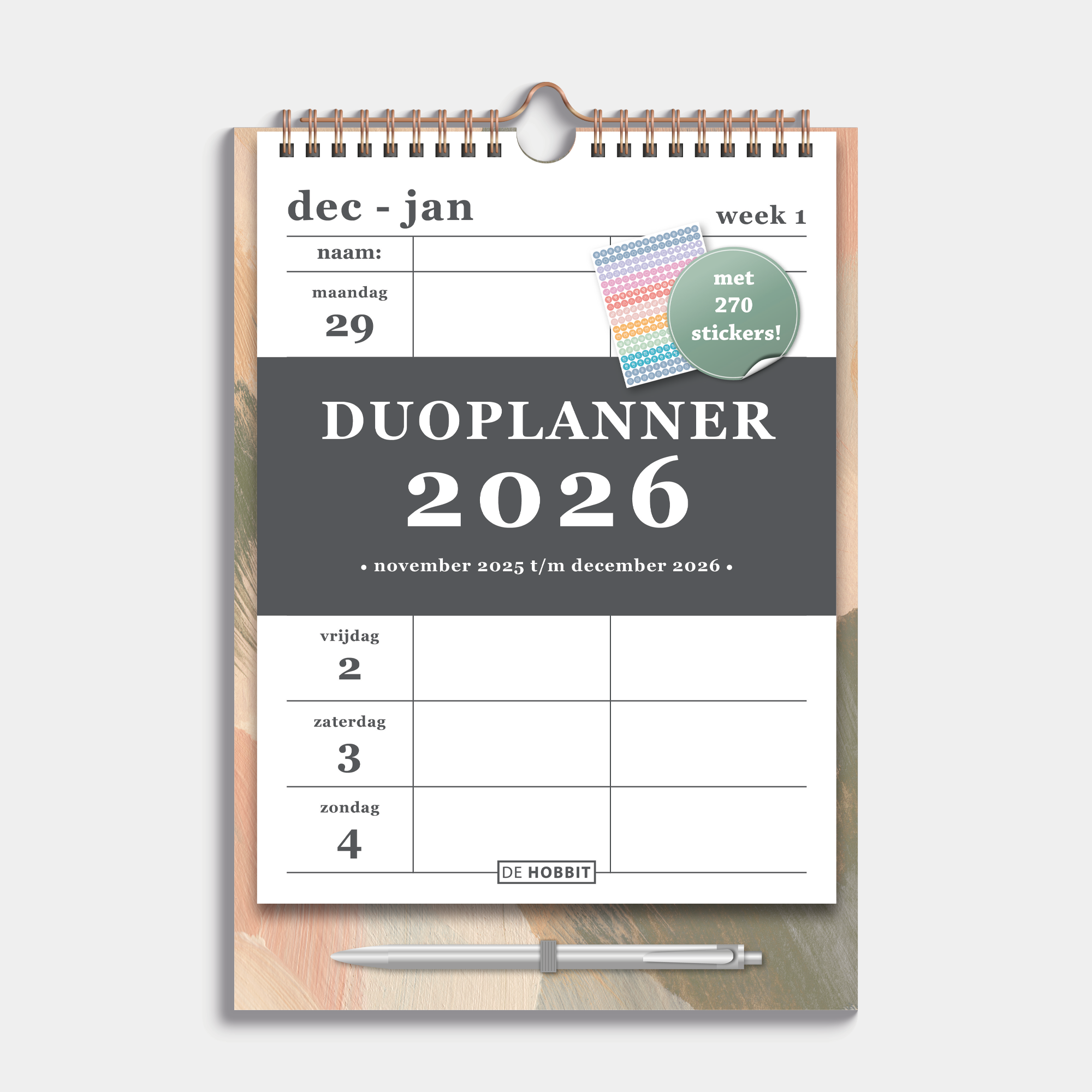 Duoplanner 2026 A4 met een dessin van abstracte verfstreken op een kartonnen bord met pen – vooraanzicht.