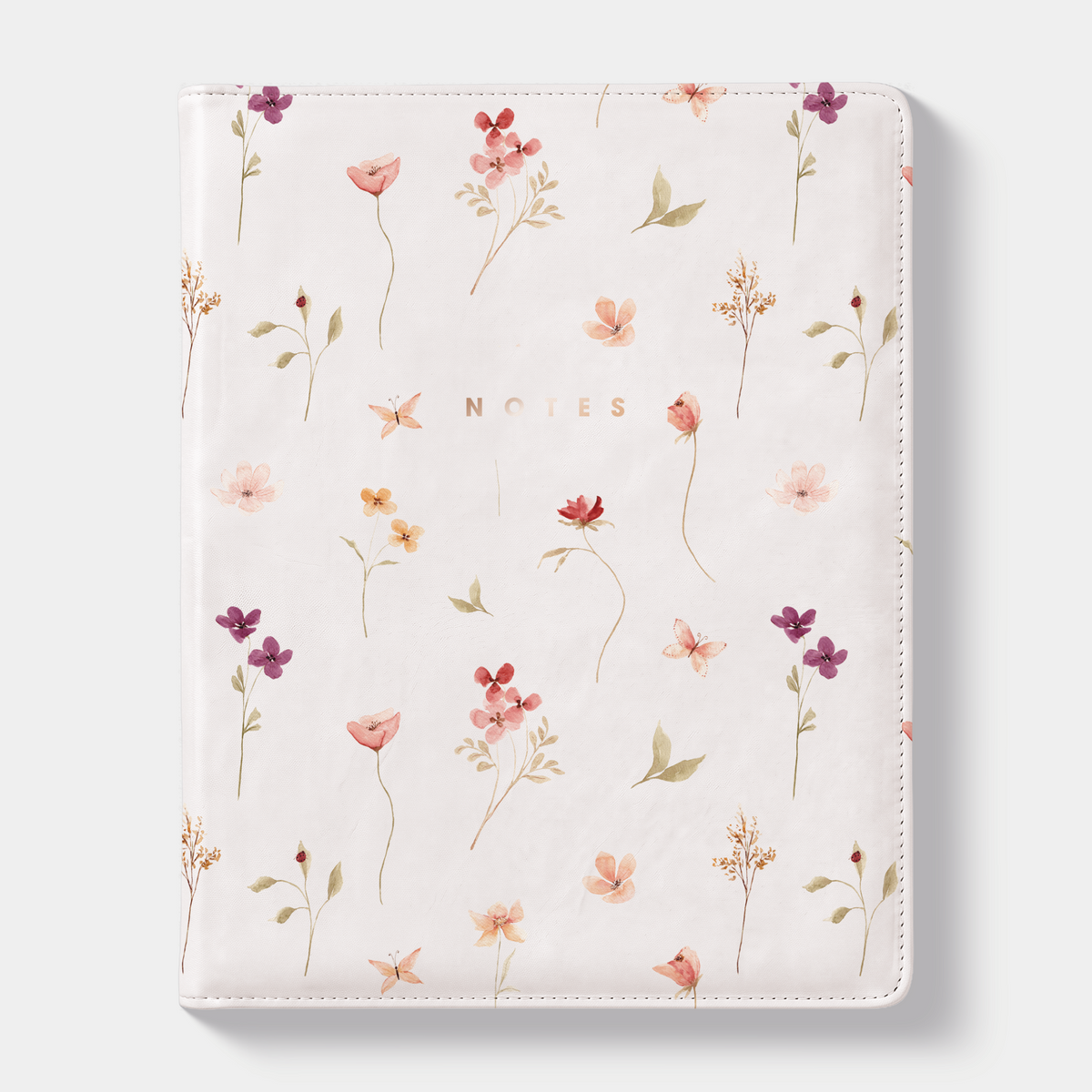 Notitieboek in het A5+ formaat met een flexibele coverhoes met een aquarel print van kleine bloemetjes – vooraanzicht met informatieve banderol.