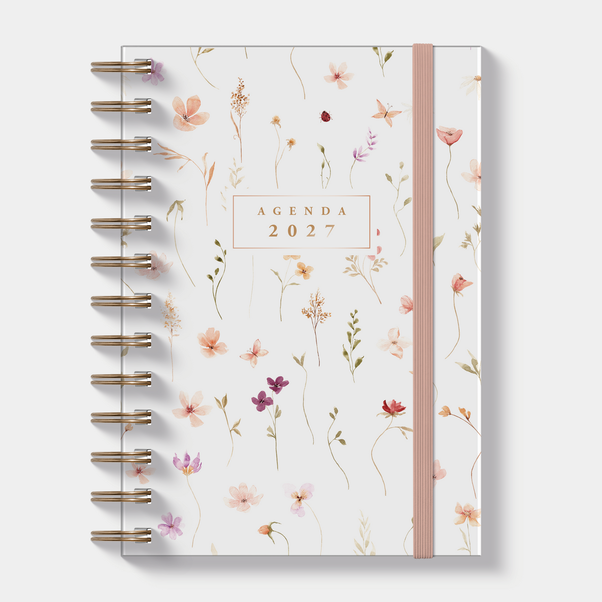 Ringband agenda 2027 in B6 formaat met print van kleine aquarel bloemetjes, harde cover en elastische sluiting – vooraanzicht.
