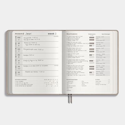 leefstijl planner 2026 met flexibele suèdelook coverafwerking – binnenwerk met voorbeeld van ingevuld weekoverzicht.