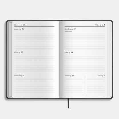A6 agenda 2025-2026 met suèdelook cover in antraciet – binnenwerk met weekoverzicht.