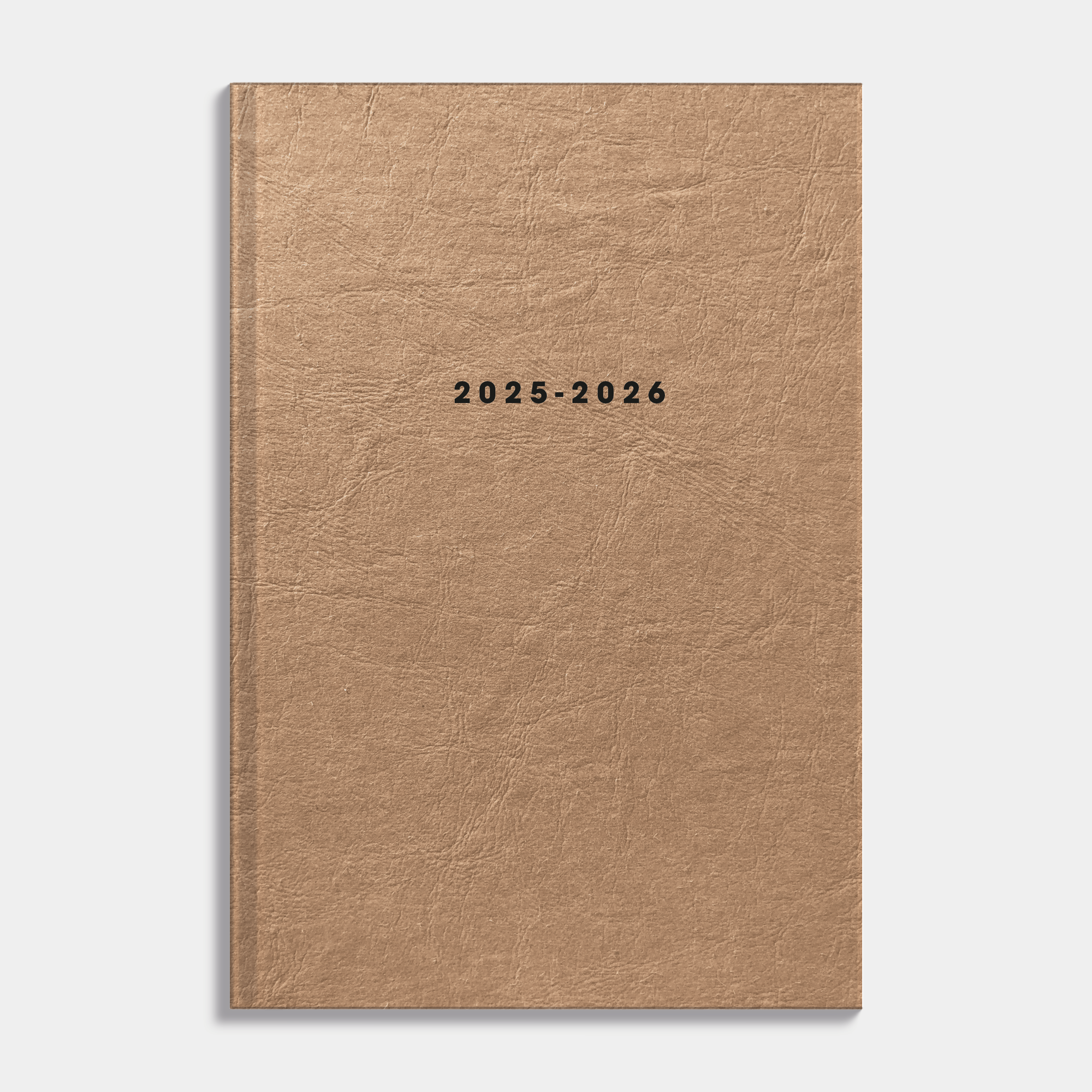 Luxe A5 schoolagenda 2025-2026 met bruine washed craft afwerking en harde cover – vooraanzicht.