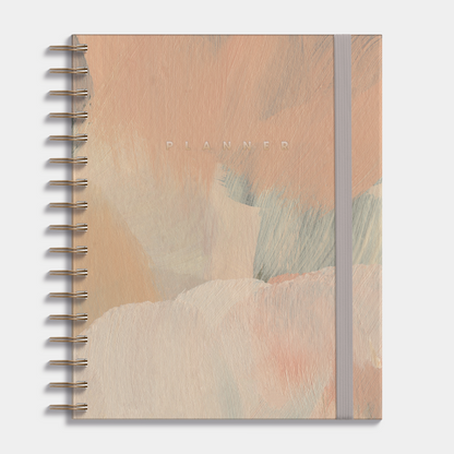 Luxe weekplanner undated A5 met een design van verfstreken in warme aardetinten, harde cover en elastische sluiting – vooraanzicht.