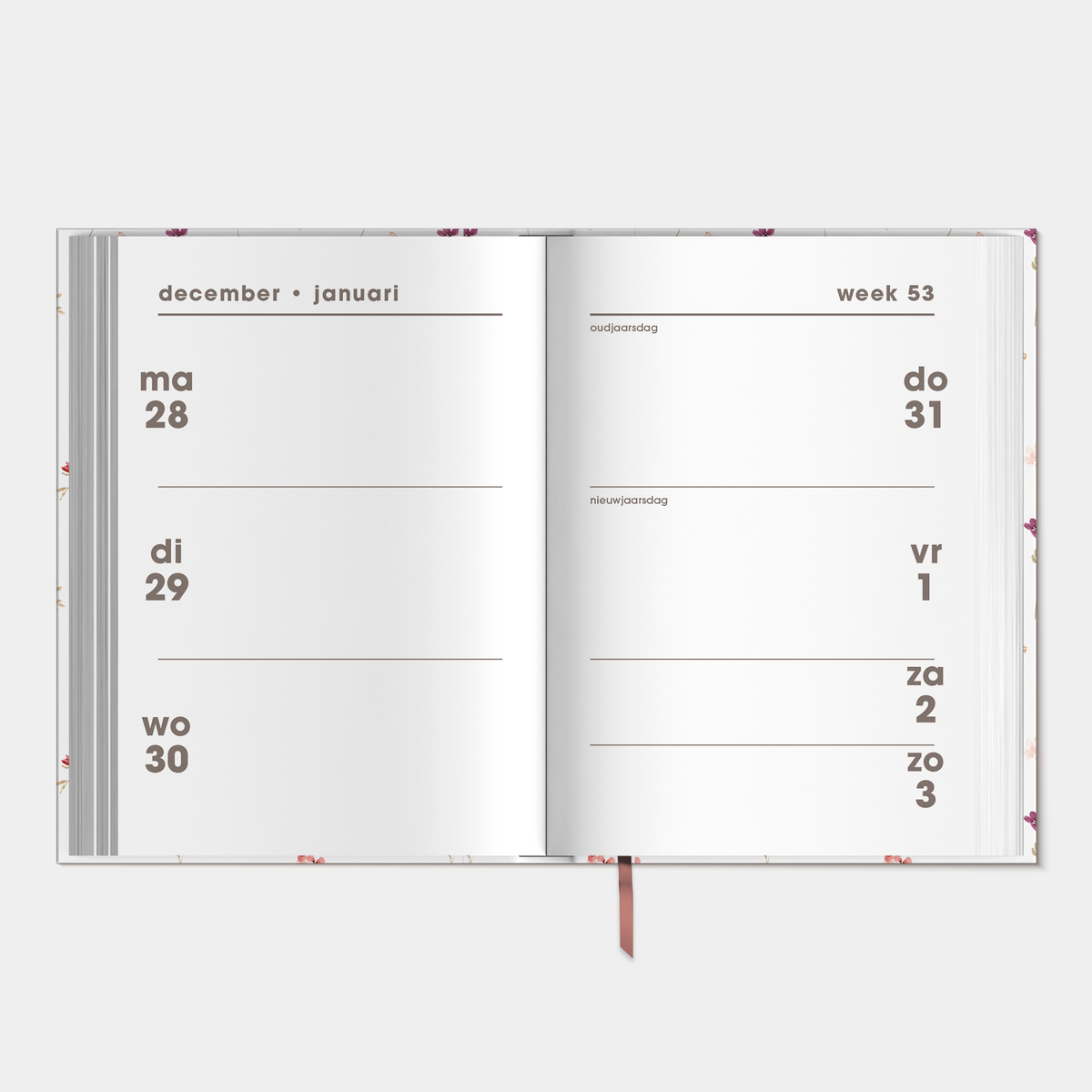 kleine agenda 2027 met print van aquarel bloemetjes op een harde cover – binnenwerk met weekoverzicht.